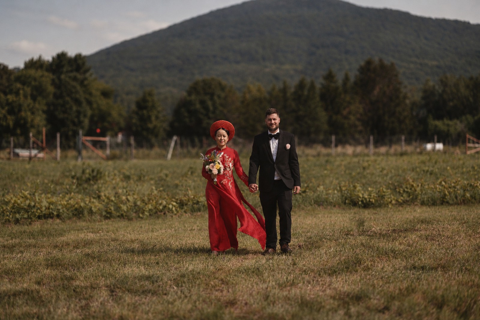 Thu and Simon in a meadow portrait in Rougemont, Quebec
