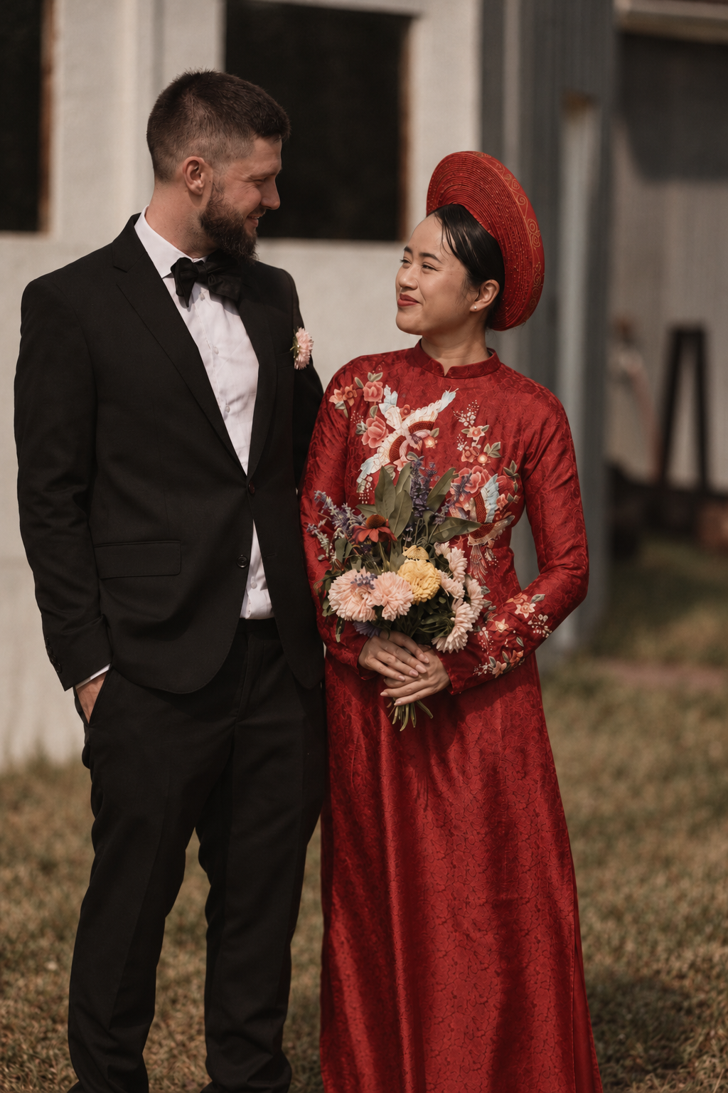 Thu in an ao dai and Simon in a tuxedo at their wedding in Rougemont, Quebec