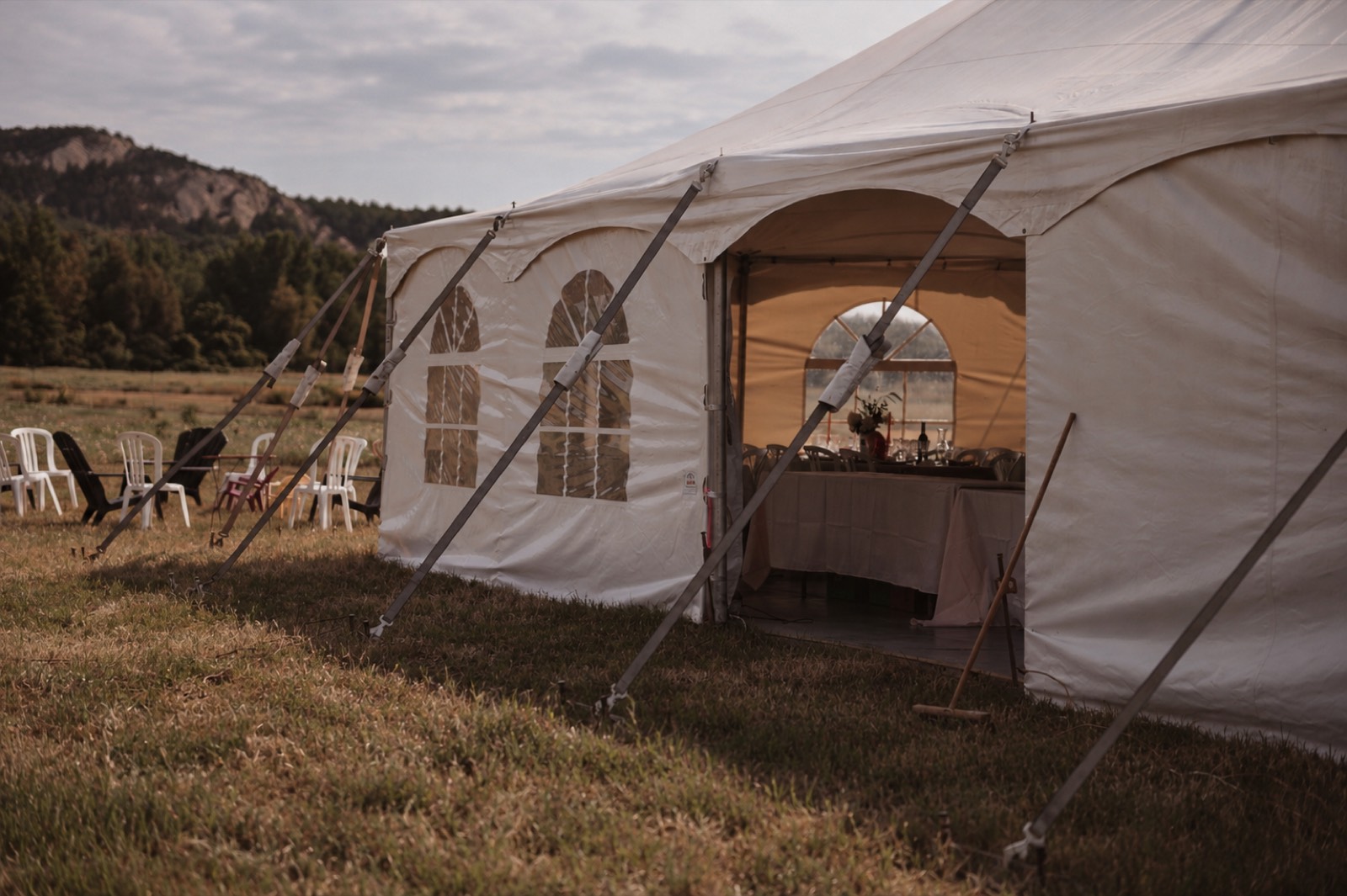 The marquee in the meadow at Thu and Simon's barn wedding in Rougemont, Quebec