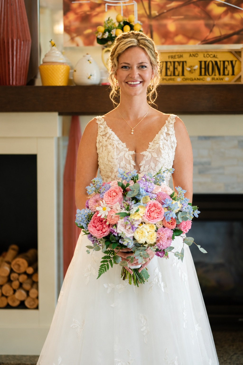Jaci with her bouquet by the fireplace in Watertown, Upstate New York