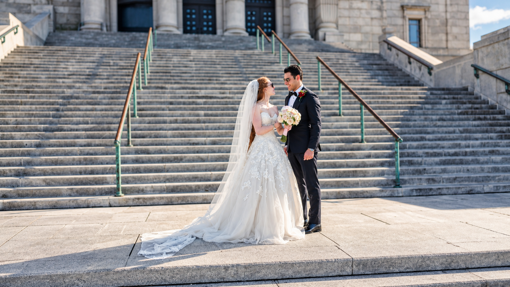 Jenna and Pouya on the grand steps in Montreal