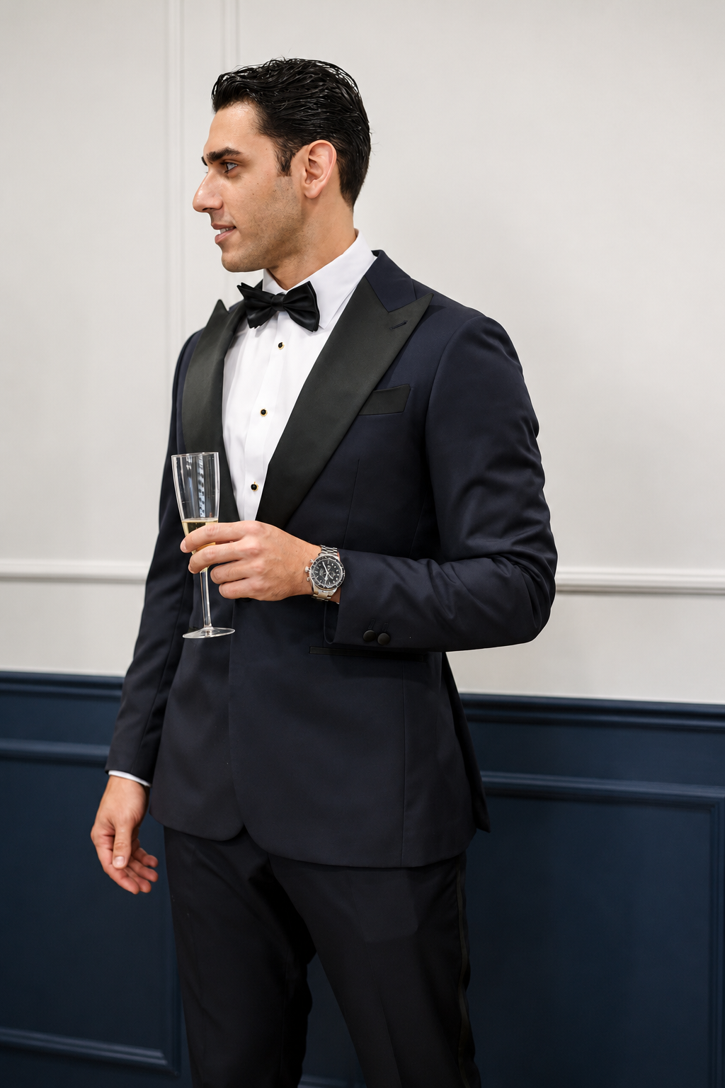 Pouya in his tuxedo with a glass of champagne