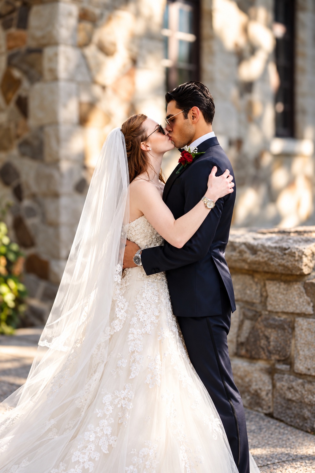 Jenna and Pouya kissing by the stone chapel