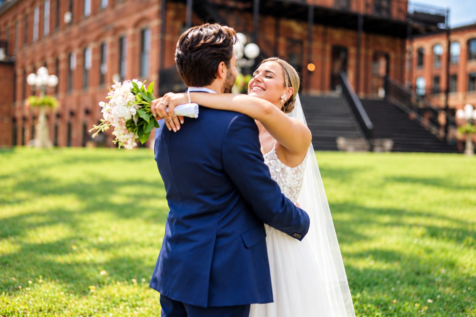 Laurie and Shadi embracing on the lawn