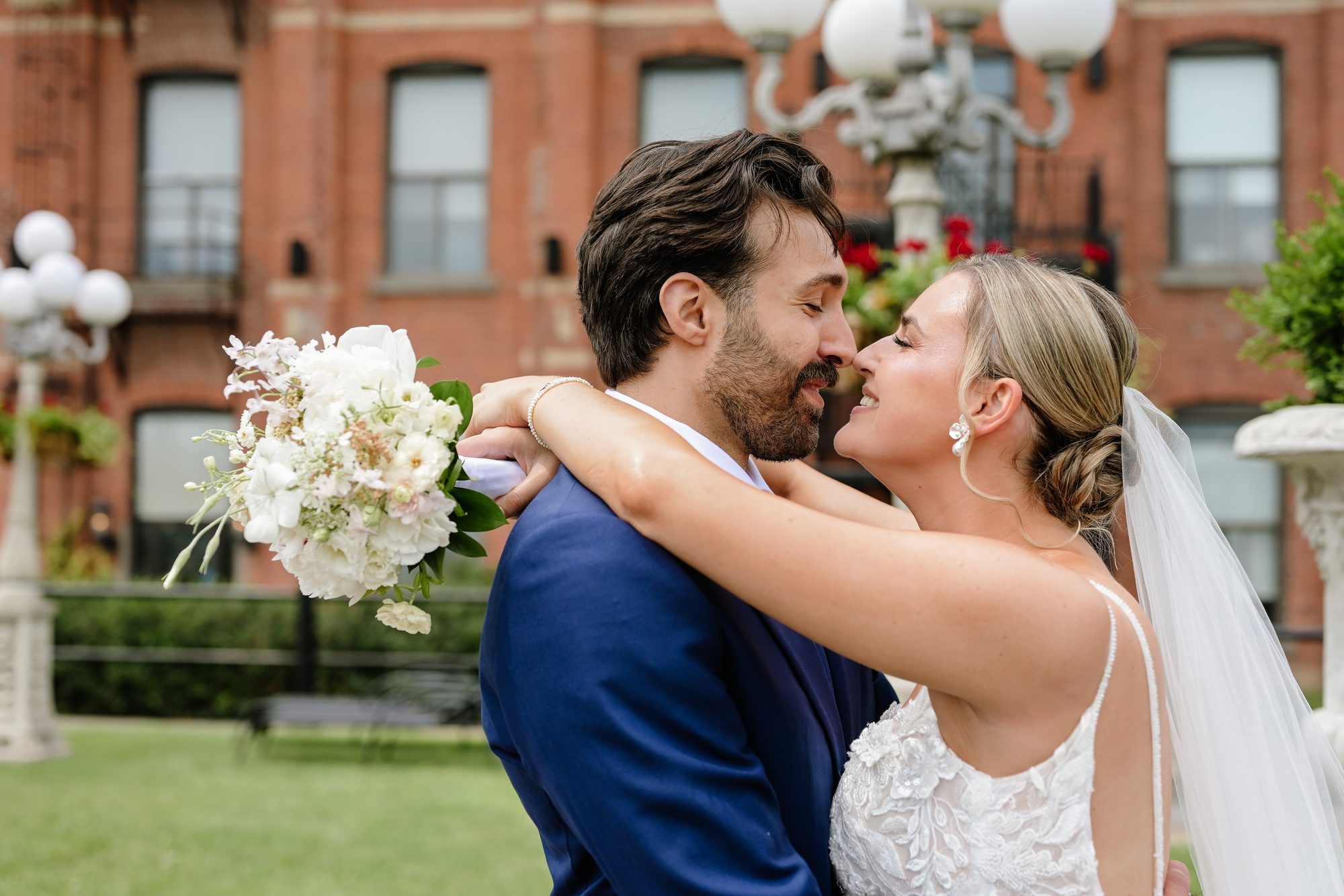 Laurie and Shadi kissing in the garden