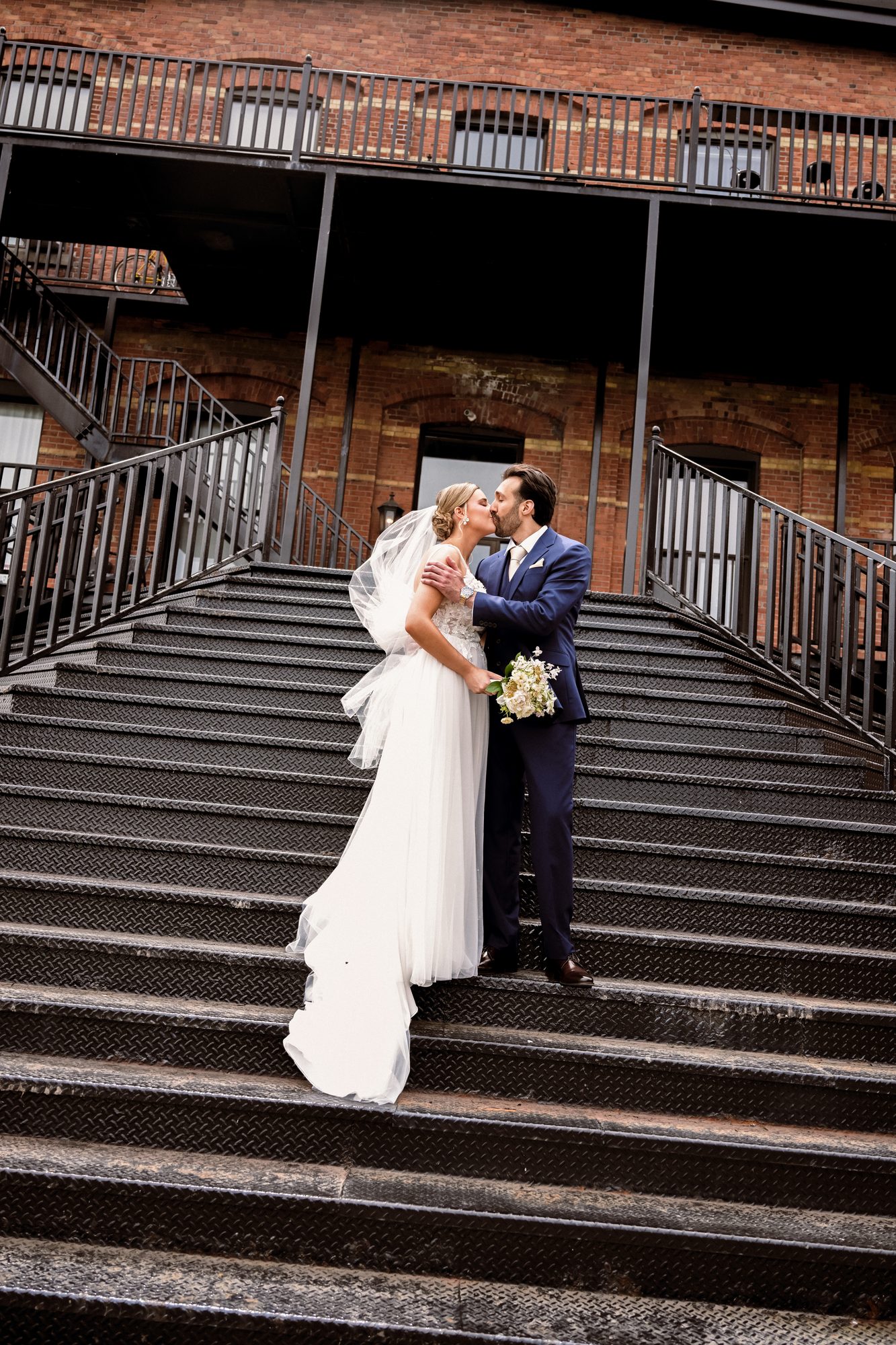 Laurie and Shadi in a portrait on the steps