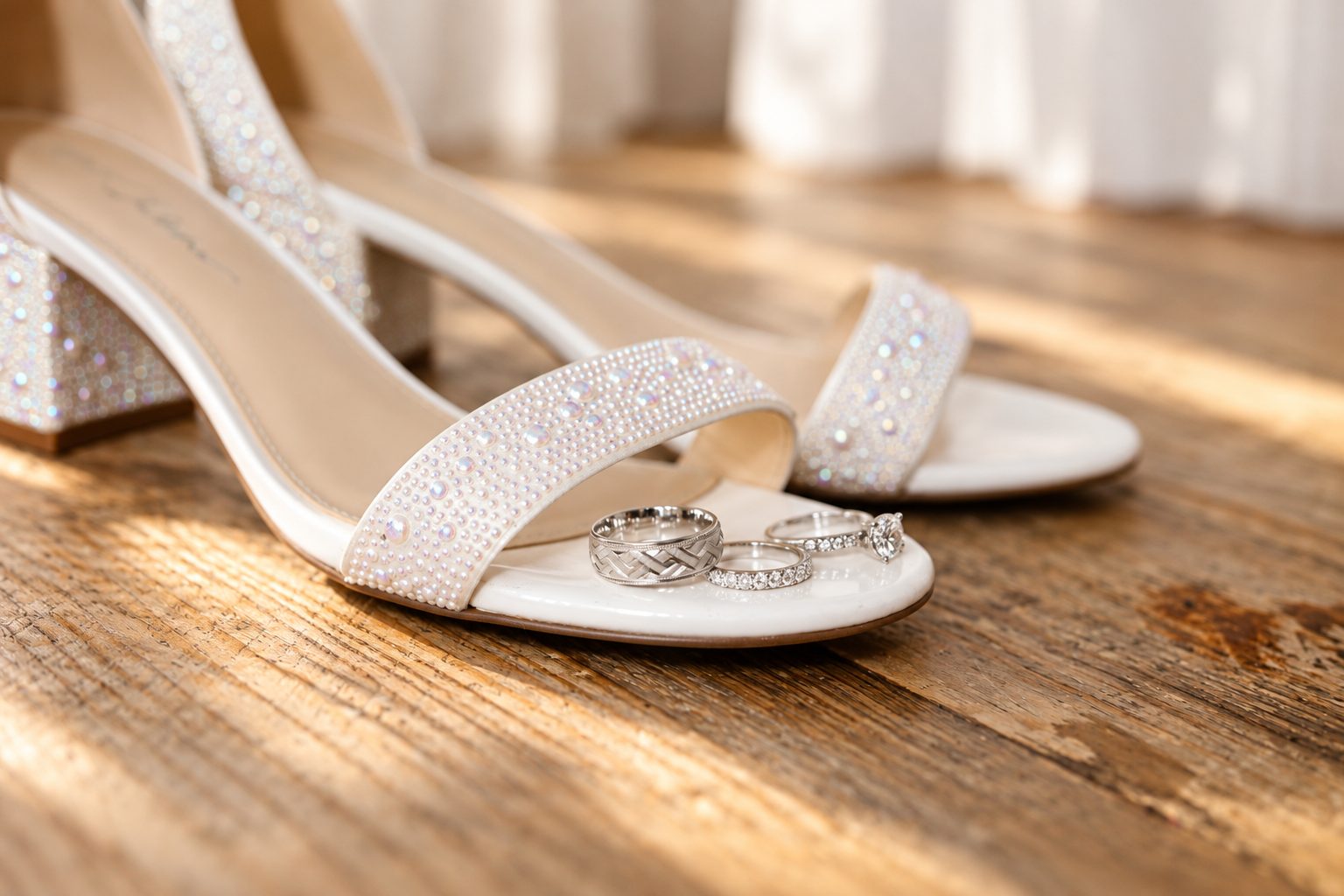 Wedding rings resting on Laurie's heels