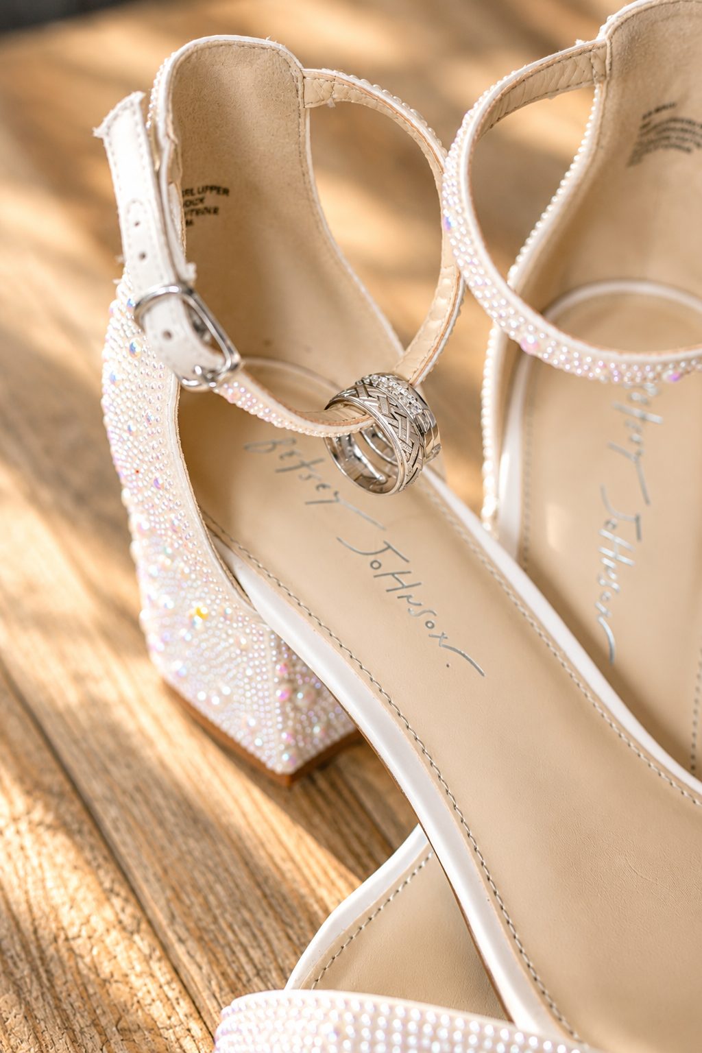 Wedding rings on the strap of Laurie's shoe