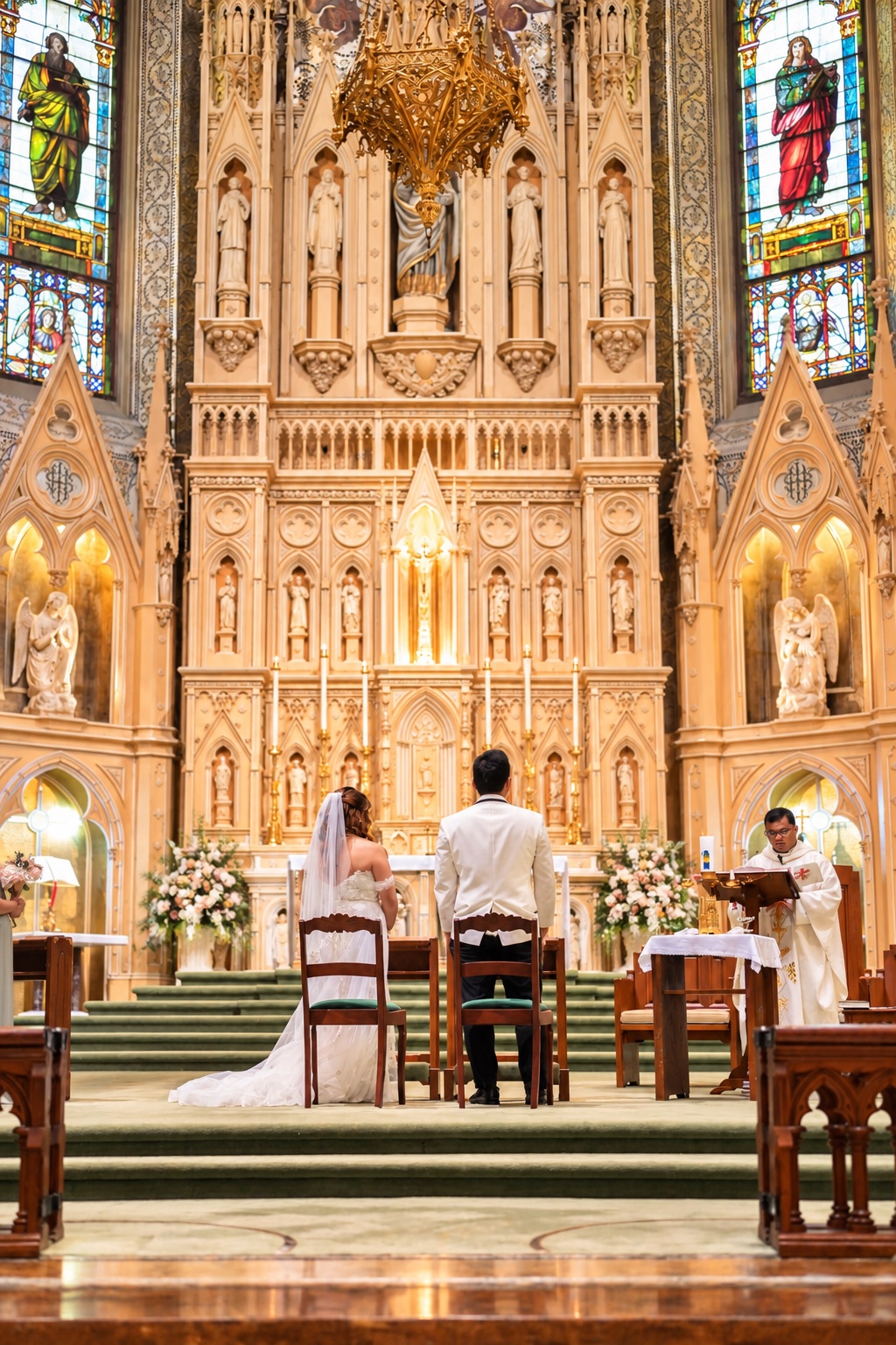 Mae and Daryl seated before the altar
