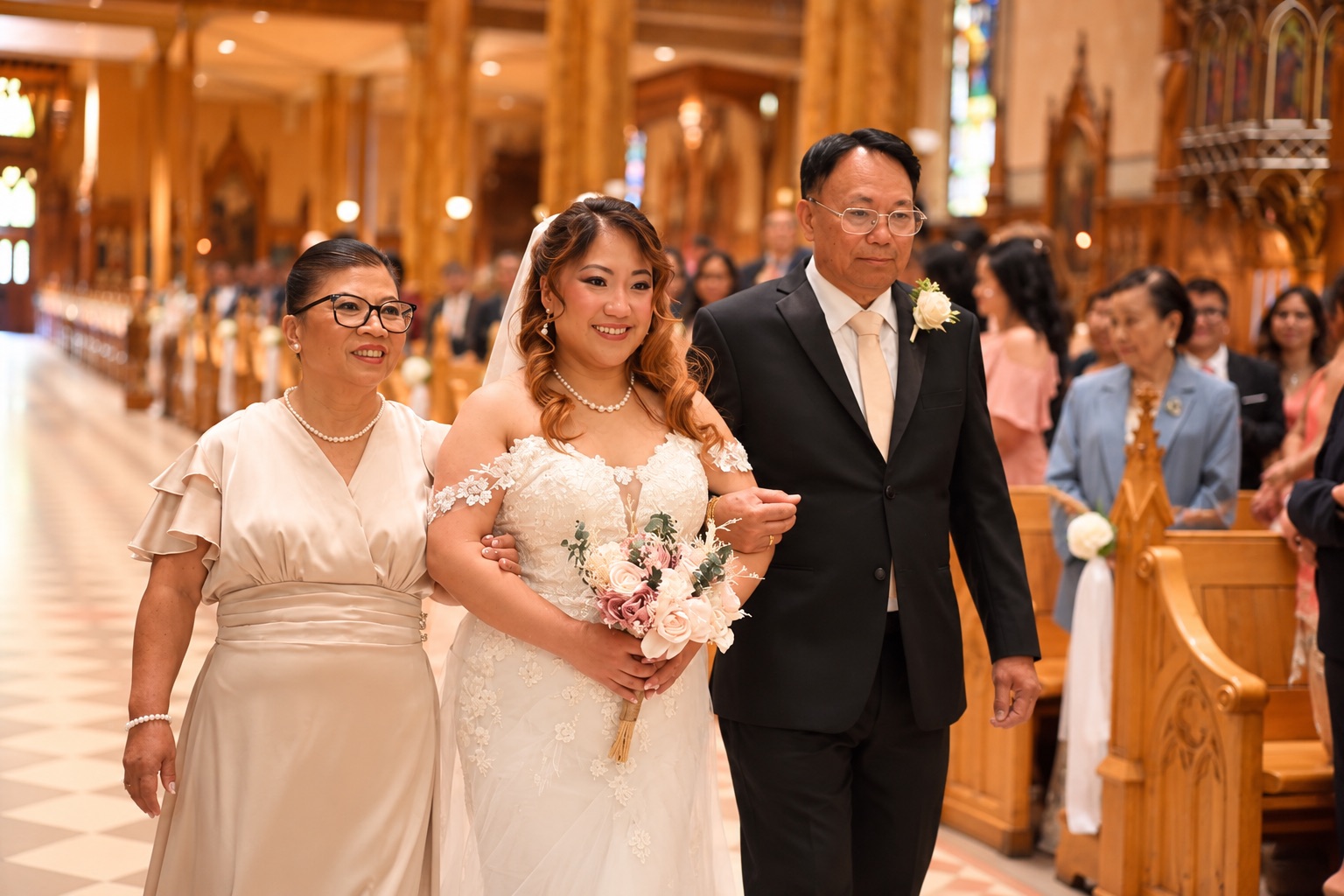 Mae walking down the aisle with her parents