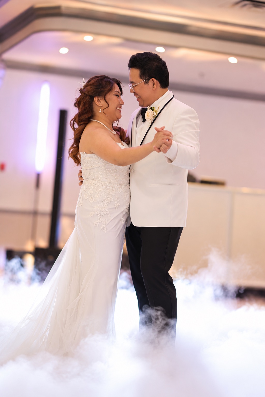 Mae and Daryl smiling during their first dance