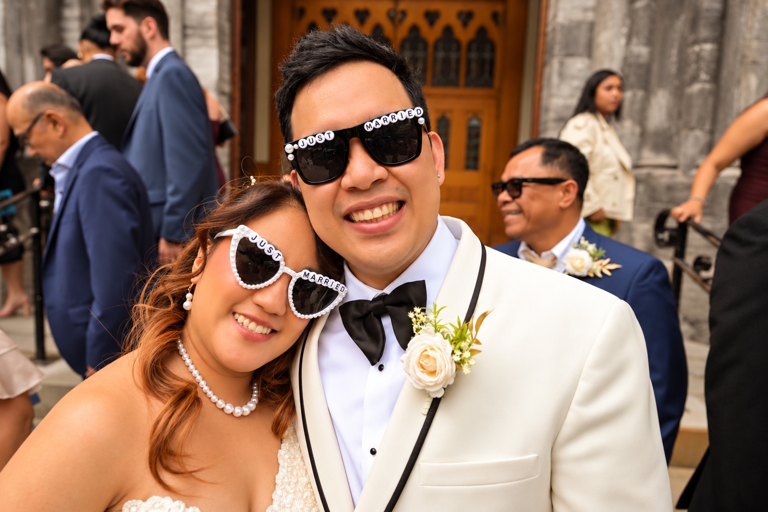 Mae and Daryl in just married sunglasses