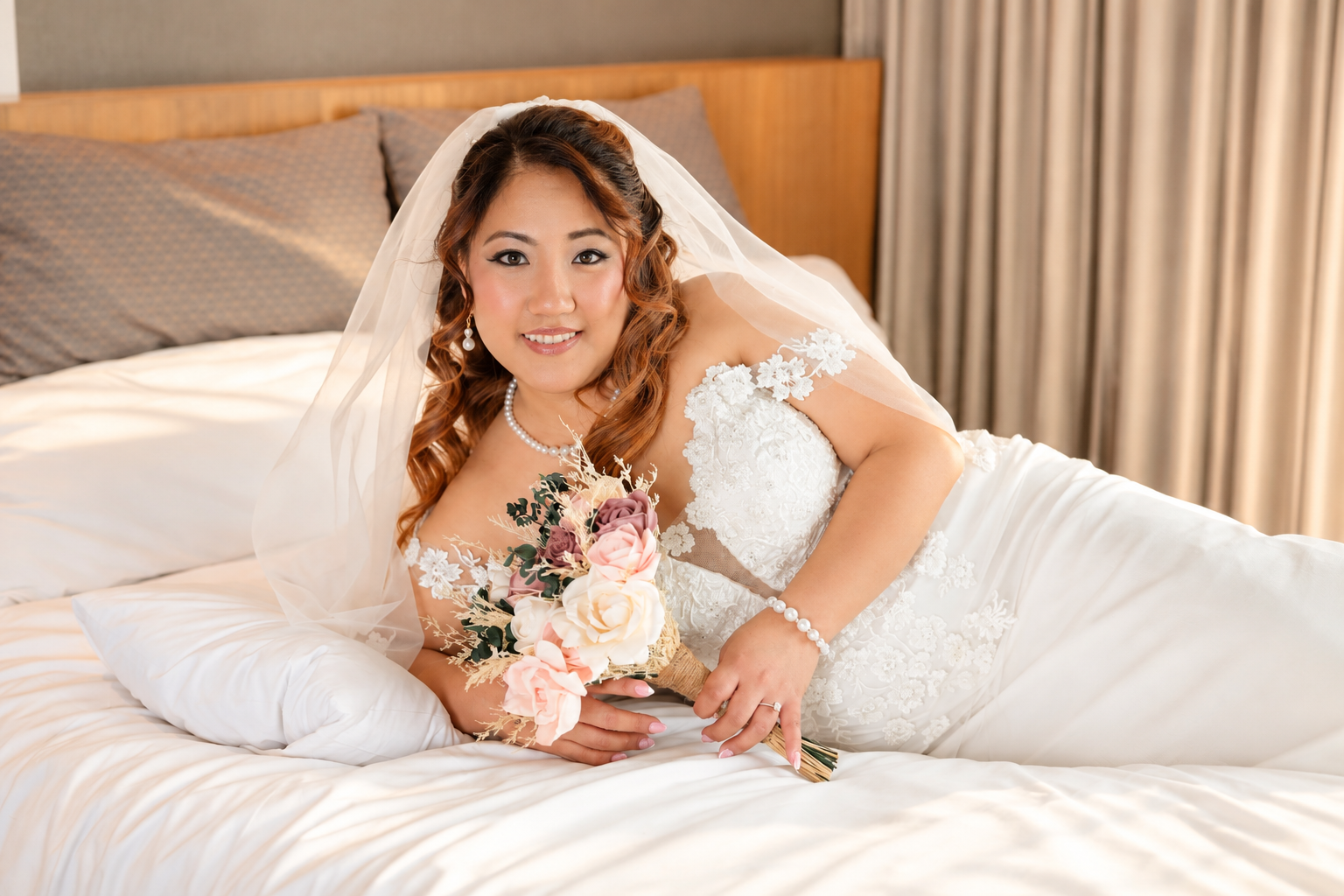 Mae veiled on the bed with her bouquet